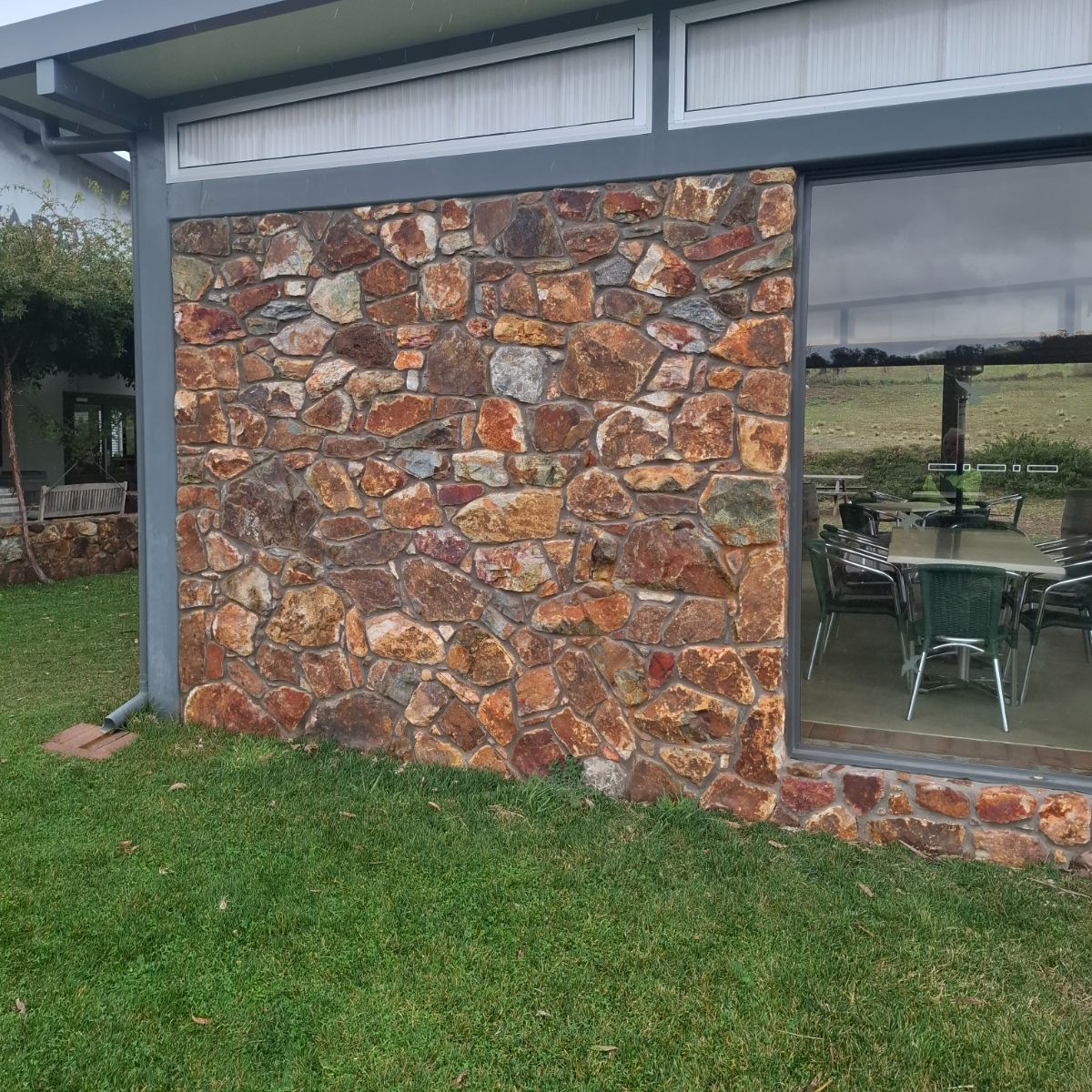 Field stone, mortared joint wall, natural stone masonry by Homestead Stonework, Canberra region