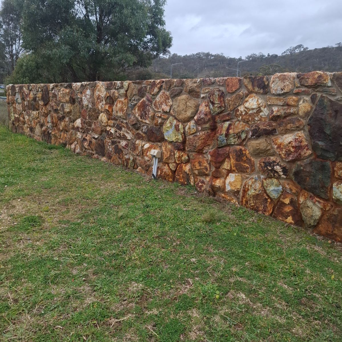 Field stone wall with mortared joints, built by Homestead Stonework Canberra