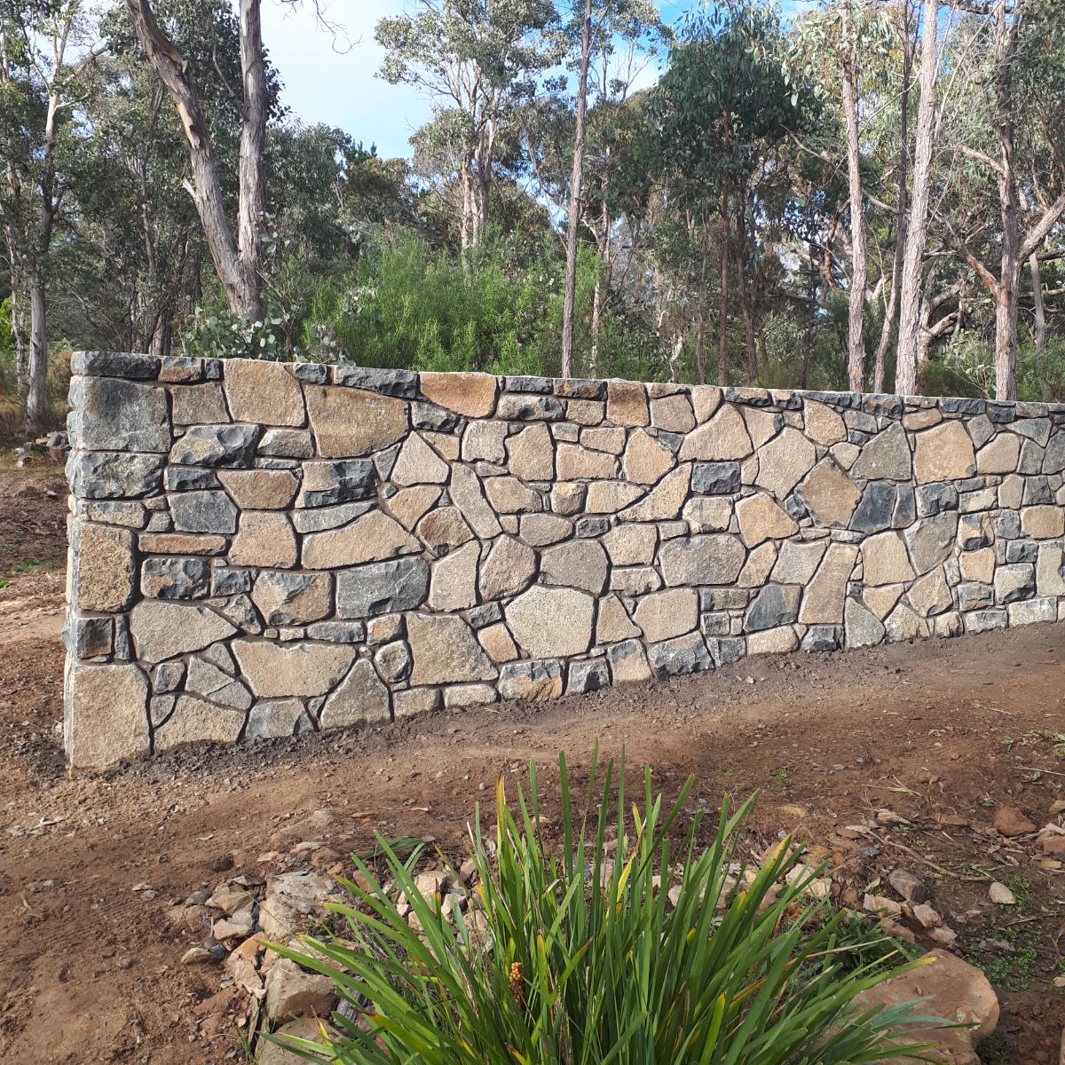 Nimmitabel basalt feature wall with raked mortar joints, Canberra