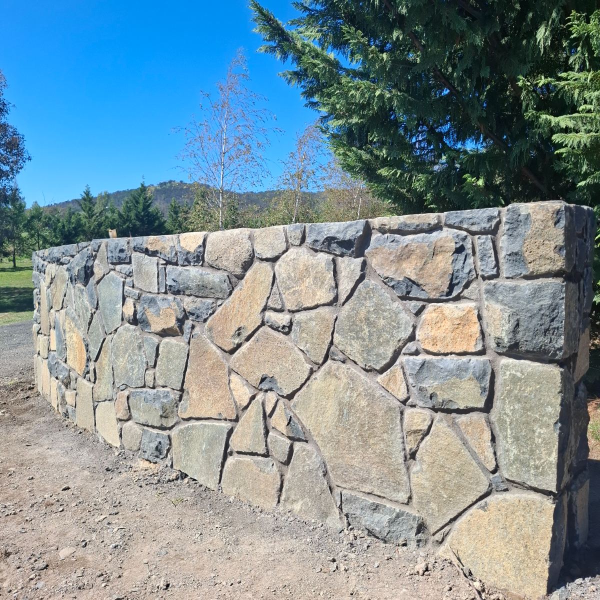 Nimmitabel basalt, raked mortar joint wall, natural stone masonry by Homestead Stonework, Canberra region