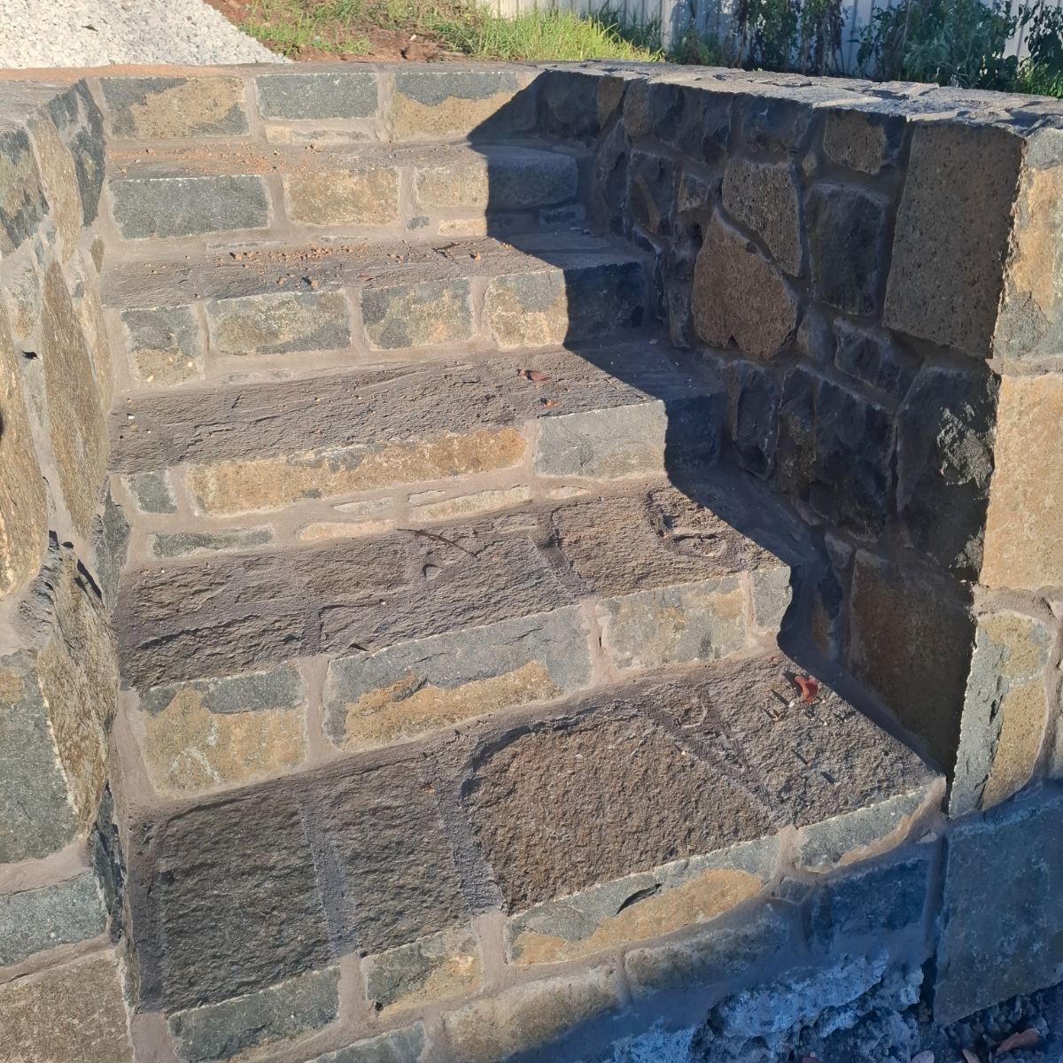 Basalt stone staircase and retaining wall, built by Homestead Stonework Canberra