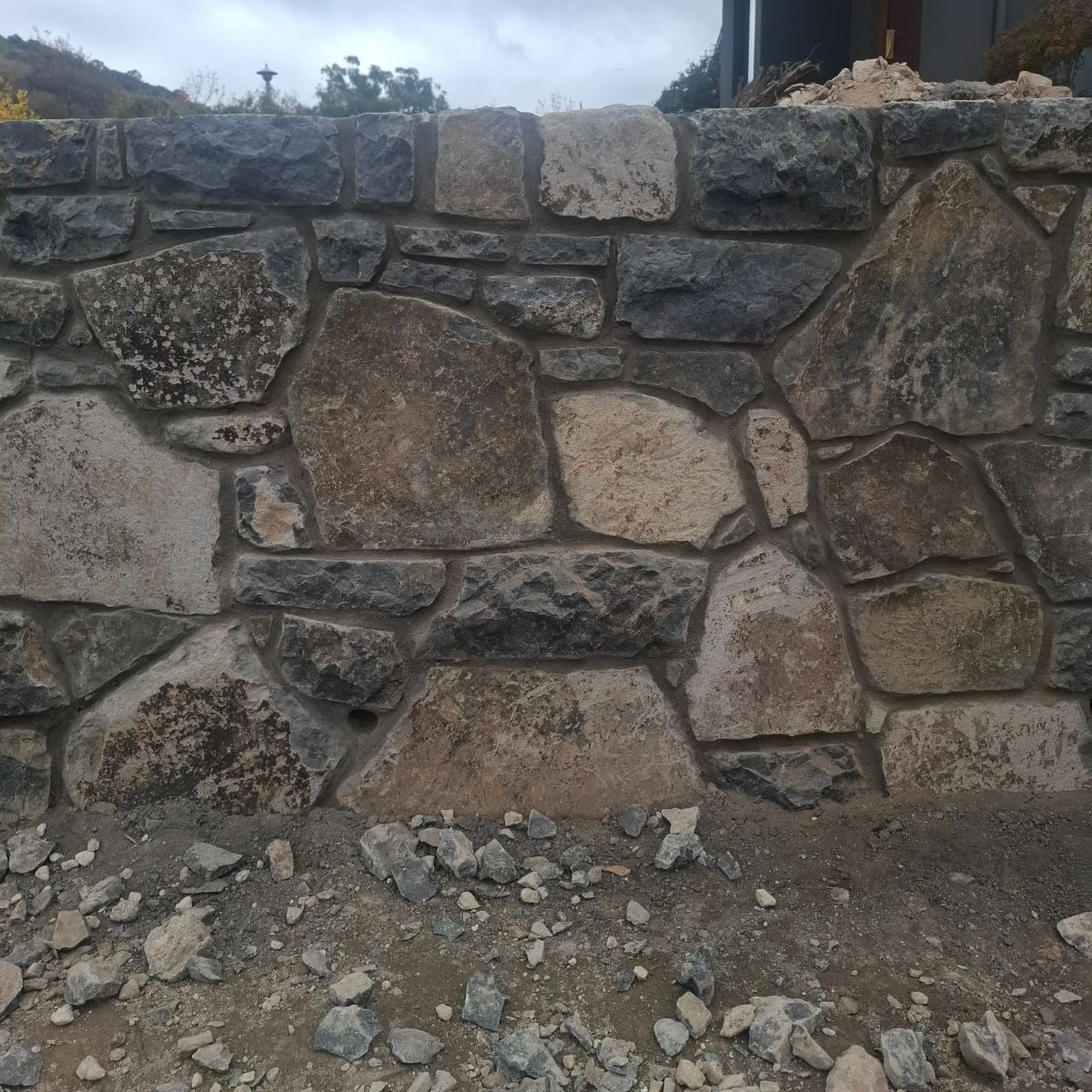 Wee Jasper basalt, raked mortar joint wall, natural stone masonry by Homestead Stonework, Canberra region